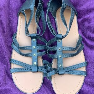 Black flat sandals with gold studs